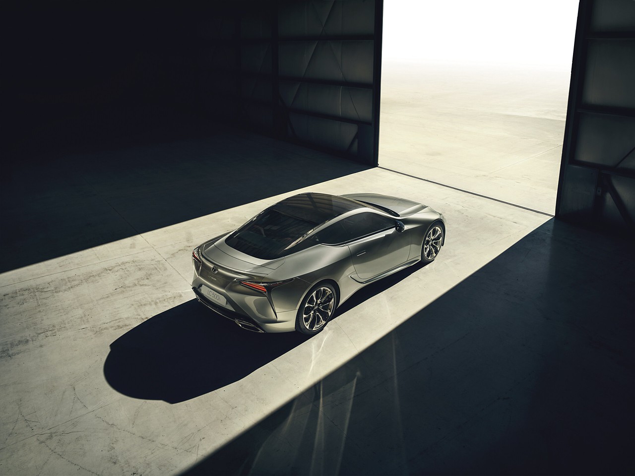 Lexus LC driving through a town