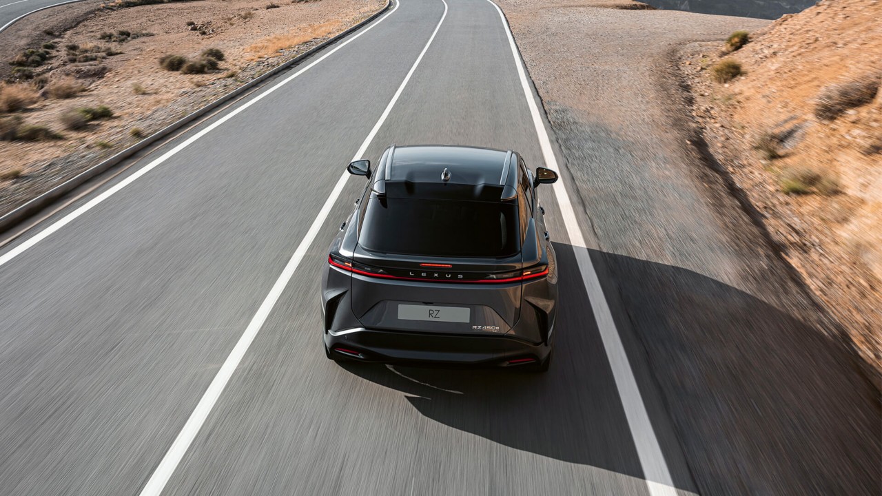 Rear view of the Lexus RZ 450e driving